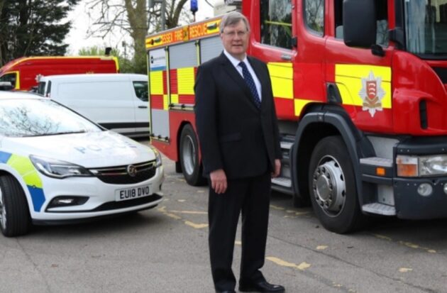 Roger Hirst MBE, with police car and ECFRS engine
