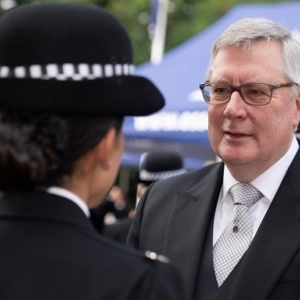Roger Hirst speaking to officer at pass out parade.