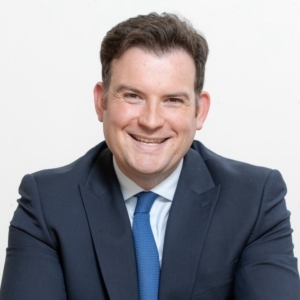 Joel Charles looking at camera