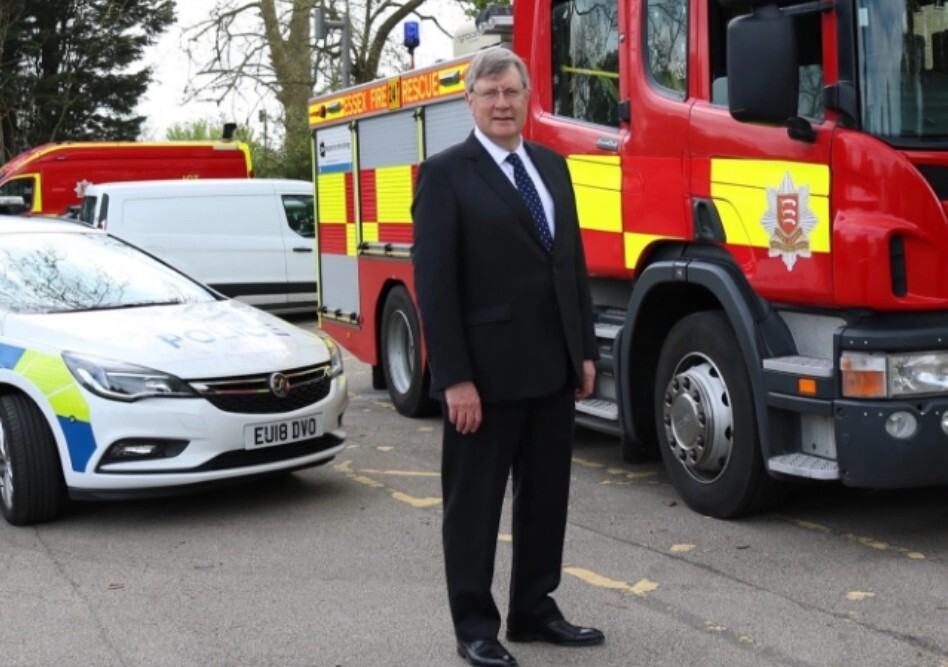 Roger Hirst MBE, with police car and ECFRS engine