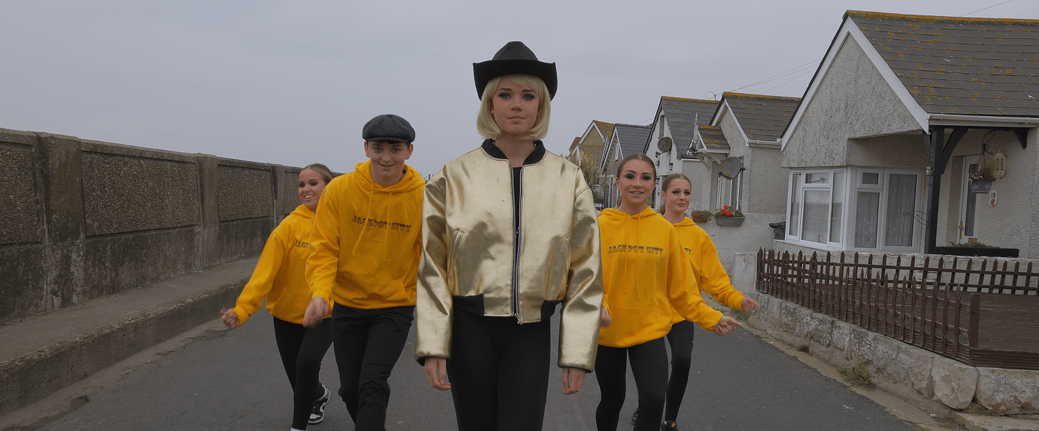 young people dancing on Jaywick seafront
