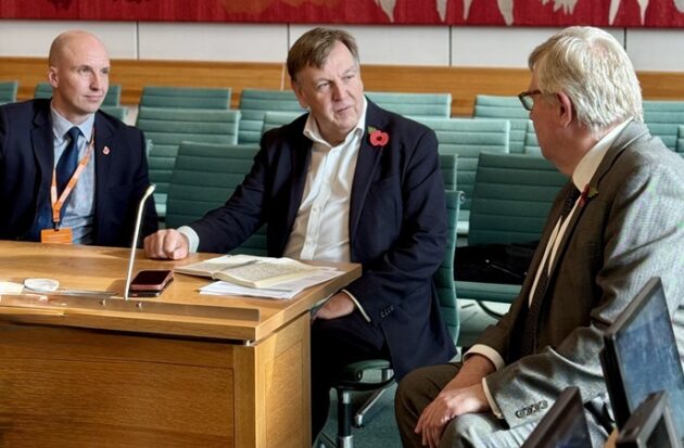 Rick Hylton, Sir John, Roger looking away