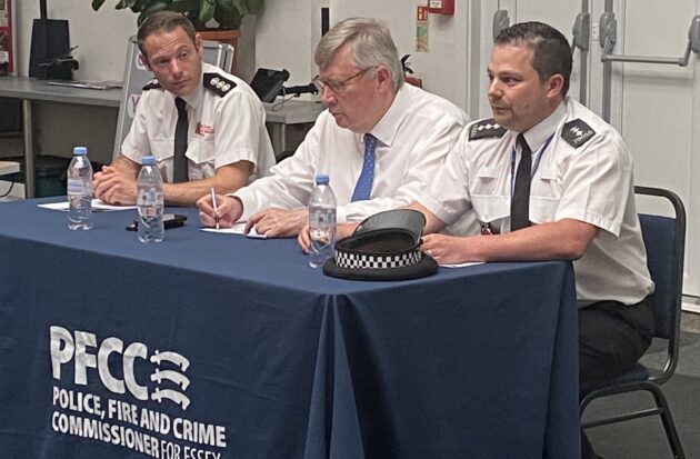 Image of panel members sitting at a table at the Tending public meeting.