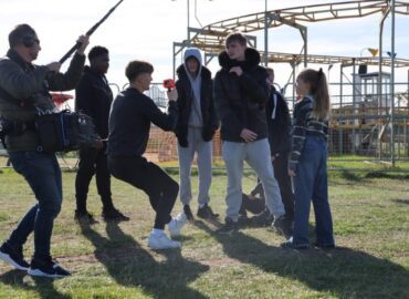 A group of young people filming a scene at Adventure Island in Southend