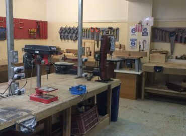 A workshop filled with different types of tools and machinery