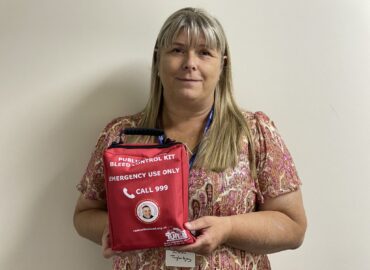 In this image Julie Taylor is holding a bleed kit